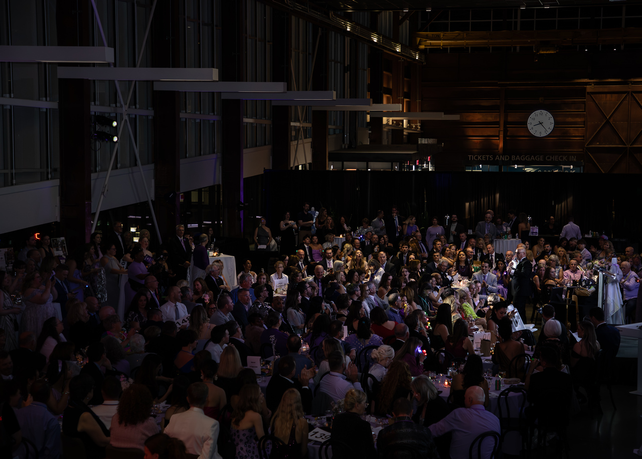 A packed house at a grand event venue